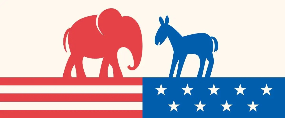 red elephant looking at blue donkey on American flag